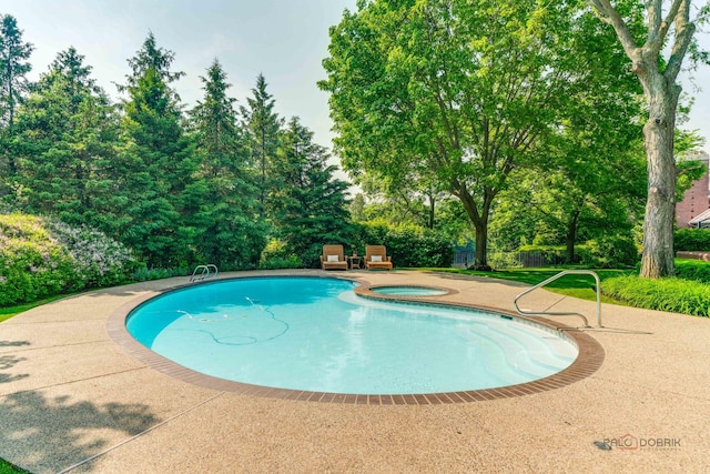 1330 Kurtis Ln, Lake Forest, IL 60045 - view of pool with view of scattered trees, a pool with connected hot tub, and a patio