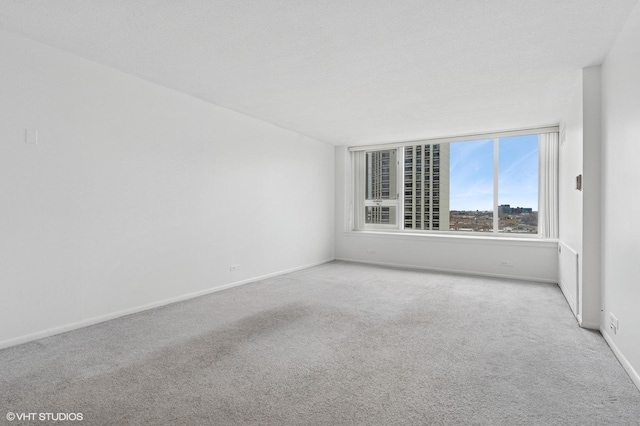 carpeted dining area with baseboards