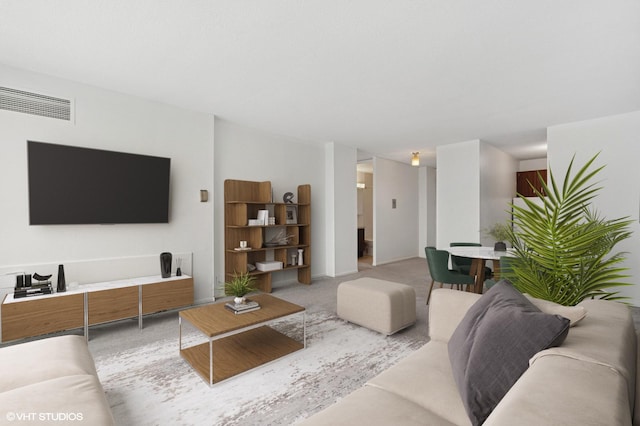 kitchen with a sink, freestanding refrigerator, electric range oven, light floors, and light countertops