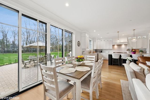 dining area with recessed lighting and light wood-type flooring