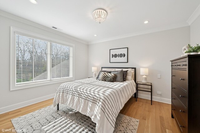 bedroom with ornamental molding, baseboards, light wood-style floors, and recessed lighting