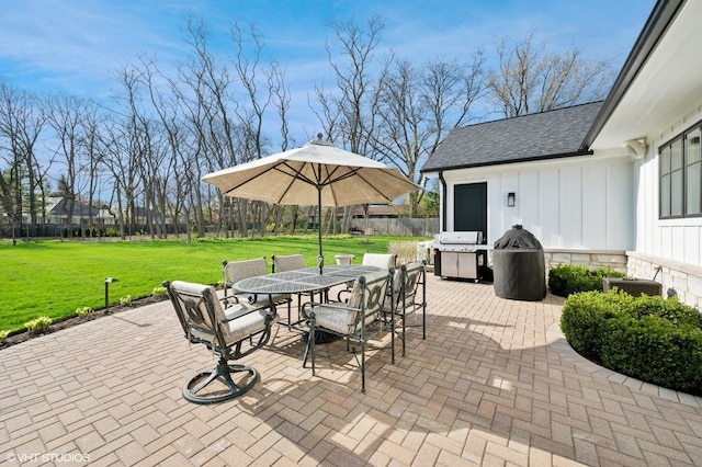 view of patio / terrace with outdoor dining space and grilling area