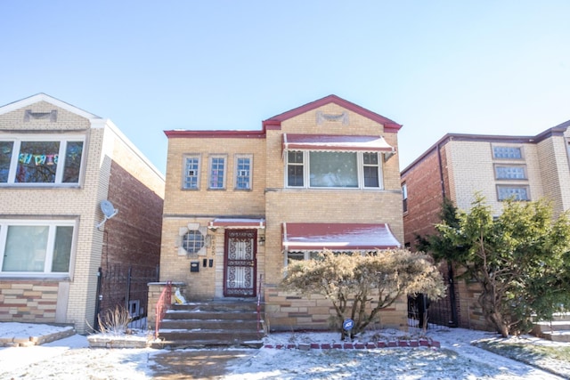 view of front of home with brick siding