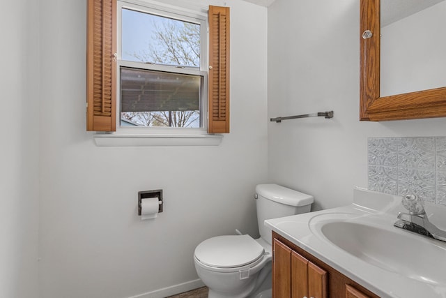 bathroom with toilet and vanity