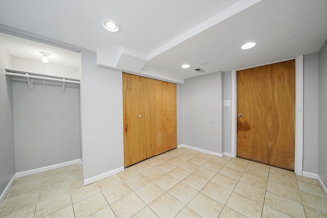 unfurnished bedroom featuring recessed lighting, baseboards, visible vents, and light tile patterned floors