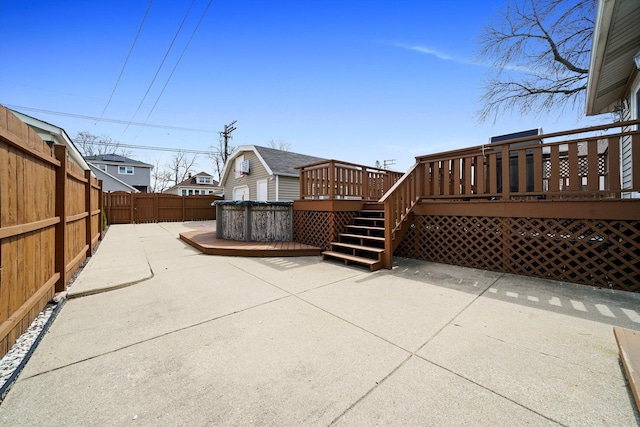 view of patio with a fenced backyard and a deck