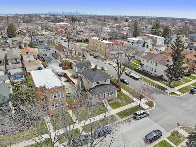 birds eye view of property with a residential view