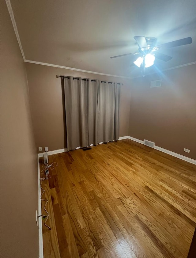 3105 172nd St, Hazel Crest, IL 60429 - spare room featuring ornamental molding, wood finished floors, ceiling fan, and baseboards