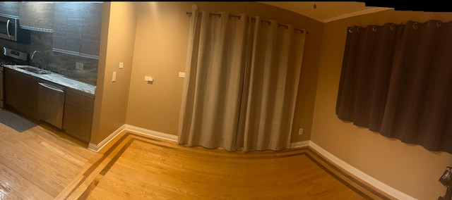3105 172nd St, Hazel Crest, IL 60429 - bathroom with wood finished floors, baseboards, a sink, and crown molding