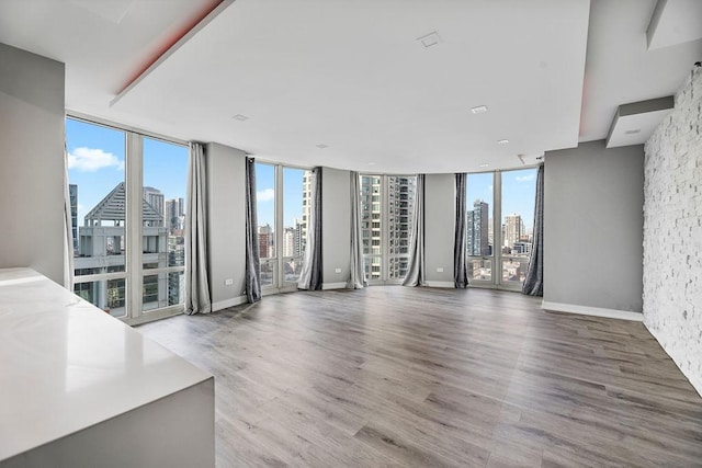 345 N La Salle Dr Unit 2501, Chicago, IL 60654 - unfurnished living room with a view of city, a healthy amount of sunlight, and wood finished floors