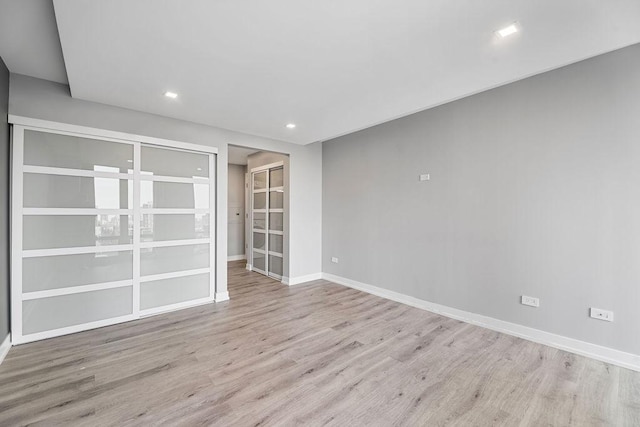 345 N La Salle Dr Unit 2501, Chicago, IL 60654 - spare room with baseboards, wood finished floors, and recessed lighting