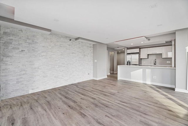 345 N La Salle Dr Unit 2501, Chicago, IL 60654 - unfurnished living room featuring light wood finished floors and a sink