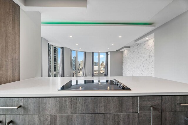 345 N La Salle Dr Unit 2501, Chicago, IL 60654 - kitchen featuring a city view, black electric stovetop, light countertops, and recessed lighting