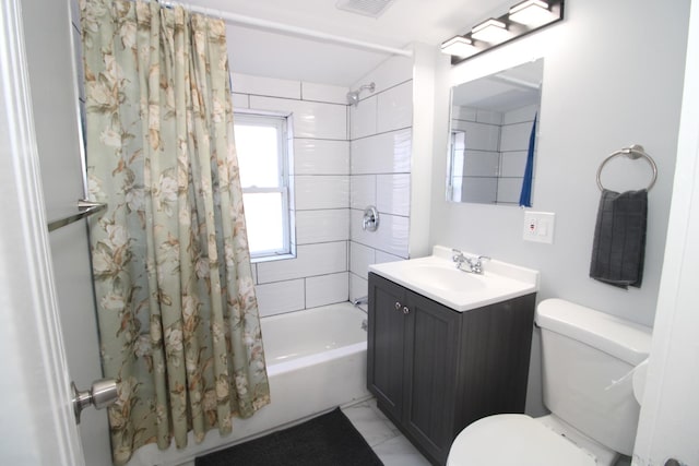 bathroom featuring shower / bath combo with shower curtain, toilet, and vanity