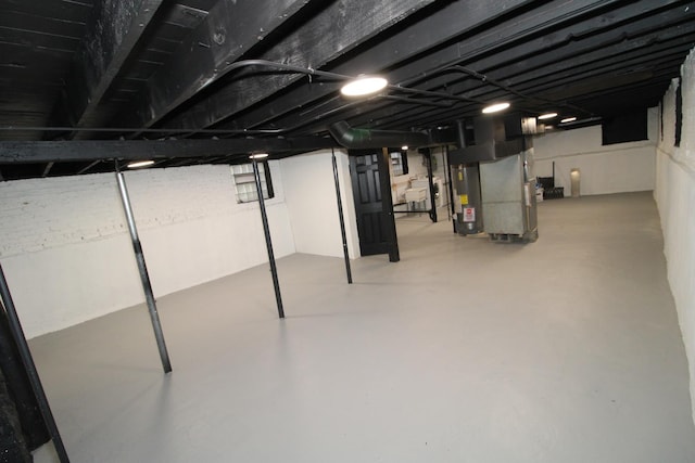 finished basement with water heater and heating unit