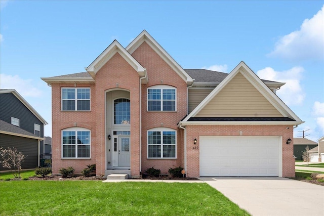 view of front of property with driveway, brick siding, a front lawn, and a garage