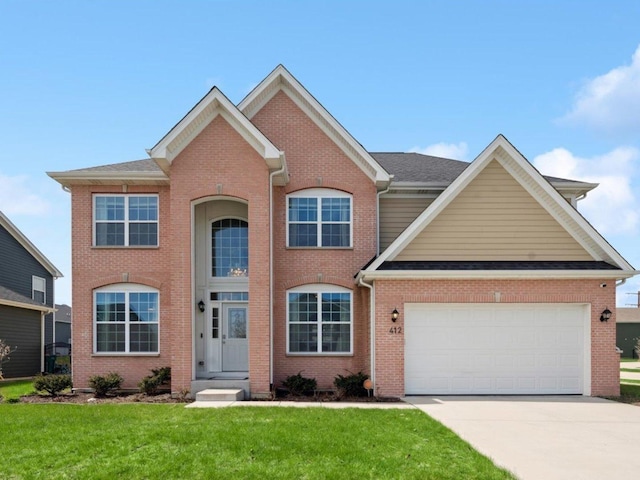 412 Towne Center Blvd, Shorewood, IL 60404 - view of front facade featuring concrete driveway, brick siding, an attached garage, and a front yard