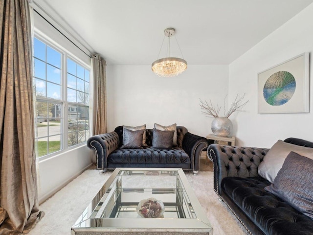 412 Towne Center Blvd, Shorewood, IL 60404 - living area with carpet flooring and a notable chandelier