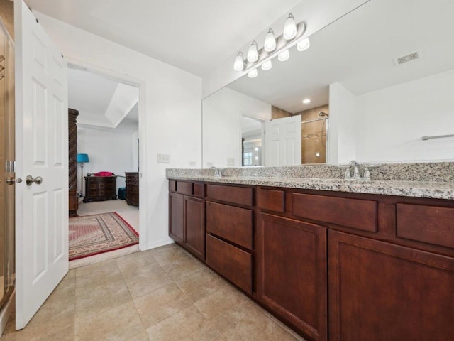 412 Towne Center Blvd, Shorewood, IL 60404 - bathroom with double vanity, a stall shower, a sink, visible vents, and tile patterned flooring