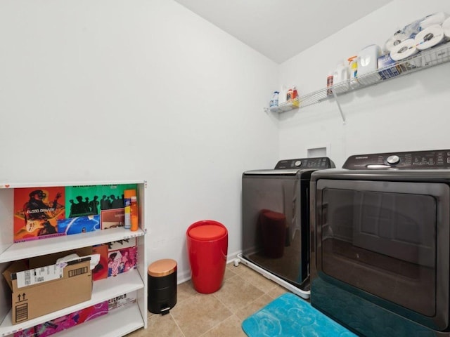 412 Towne Center Blvd, Shorewood, IL 60404 - clothes washing area with baseboards, tile patterned floors, laundry area, and washer and dryer
