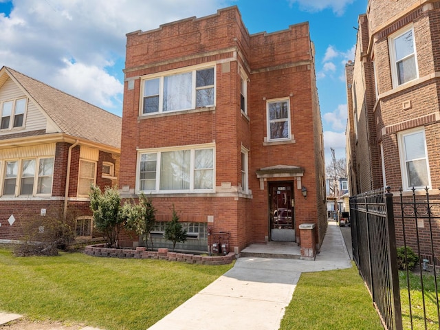 2936 N Kilpatrick Ave, Chicago, IL 60641 - view of front of house with brick siding, fence, and a front yard