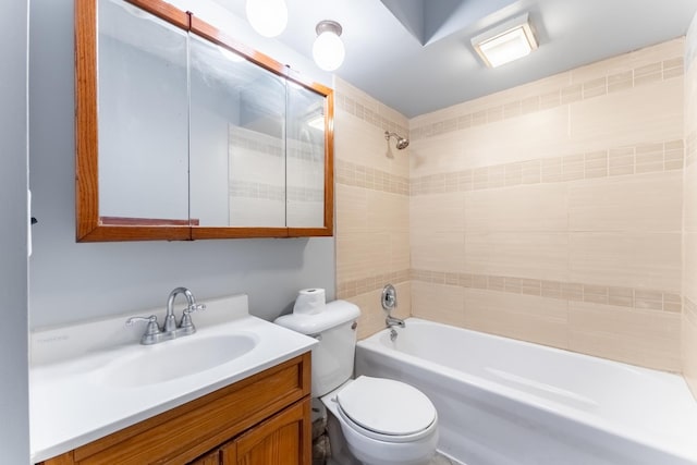 bathroom featuring toilet, vanity, and  shower combination