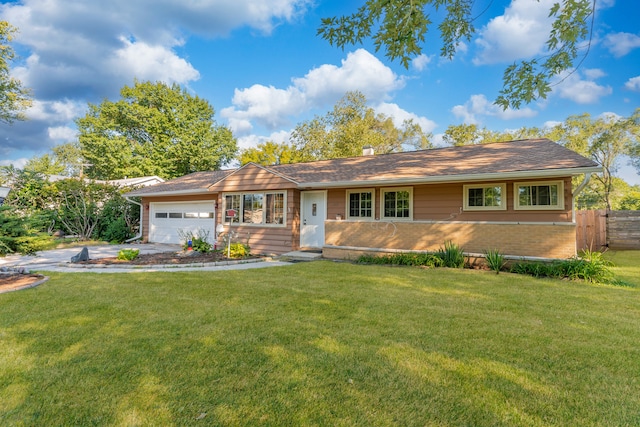 ranch-style home with an attached garage, driveway, a front lawn, and fence