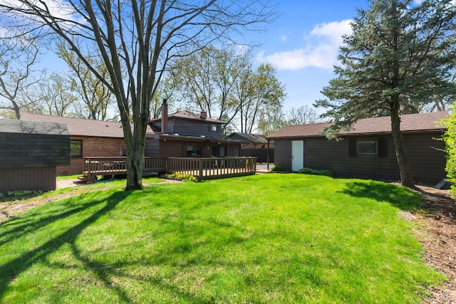 view of yard with a wooden deck