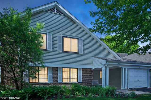 941 Yosemite Trl Unit C7, Roselle, IL 60172 - view of front of house featuring an attached garage and brick siding