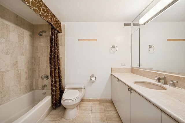161 E Chicago Ave Unit 32A, Chicago, IL 60611 - full bathroom featuring vanity, shower / tub combo with curtain, baseboards, toilet, and tile patterned flooring