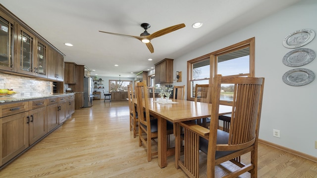 dining space featuring recessed lighting, light wood-type flooring, a ceiling fan, and baseboards