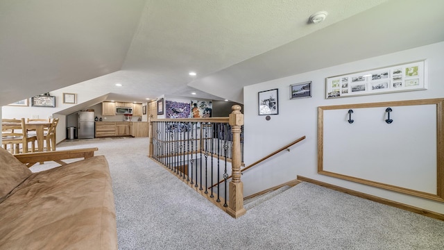 additional living space featuring light colored carpet, baseboards, lofted ceiling, and recessed lighting