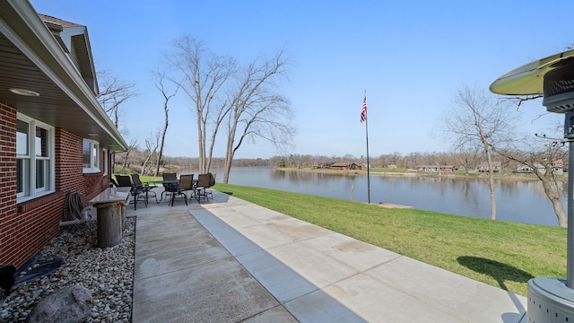 view of patio / terrace featuring outdoor dining space and a water view
