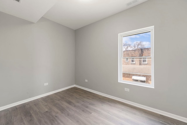 4819 W Superior St, Chicago, IL 60644 - empty room featuring wood finished floors and baseboards