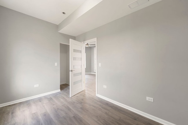 4819 W Superior St, Chicago, IL 60644 - unfurnished bedroom featuring wood finished floors and baseboards