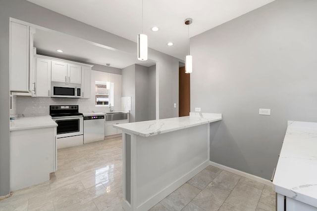 4819 W Superior St, Chicago, IL 60644 - kitchen with dishwashing machine, white microwave, range with electric cooktop, baseboards, and light stone countertops
