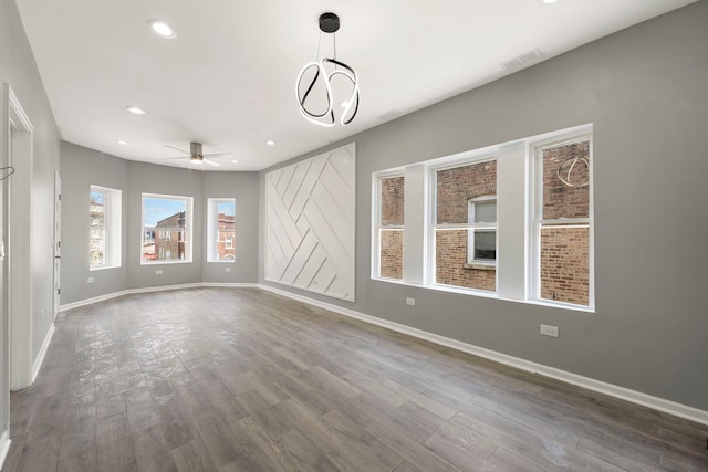 4819 W Superior St, Chicago, IL 60644 - unfurnished living room featuring baseboards, a ceiling fan, wood finished floors, and recessed lighting