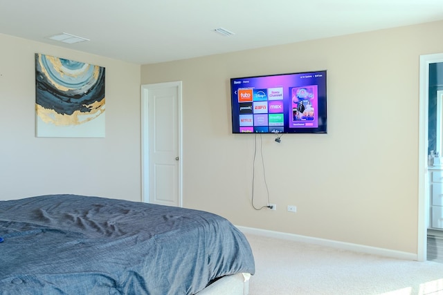 bedroom featuring visible vents, baseboards, and carpet