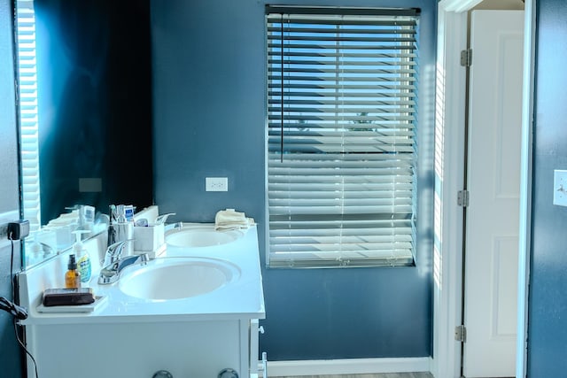 bathroom featuring double vanity and a sink