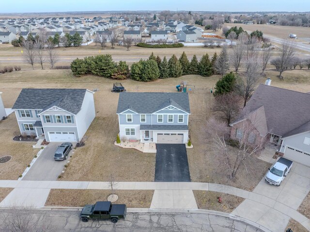 birds eye view of property with a residential view