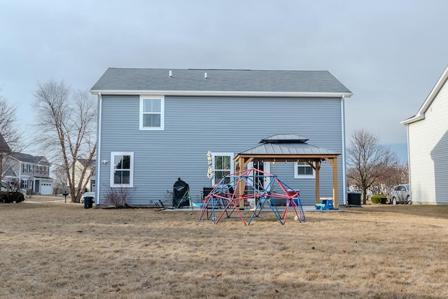 back of house featuring a lawn, a gazebo, and cooling unit