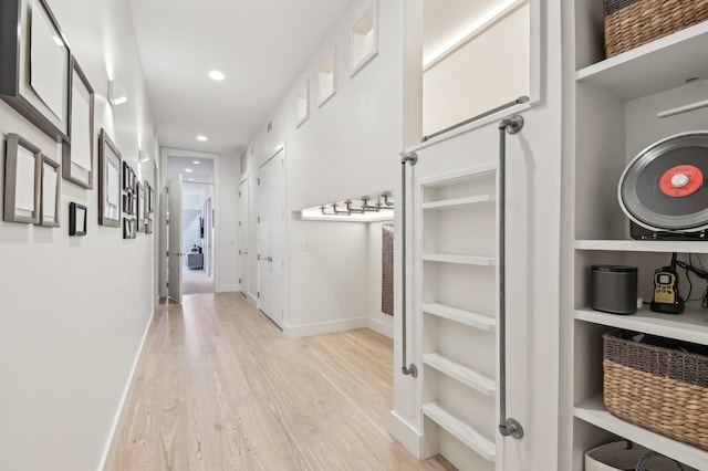 interior space with recessed lighting, baseboards, and light wood-style floors