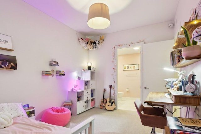carpeted bedroom with ensuite bath