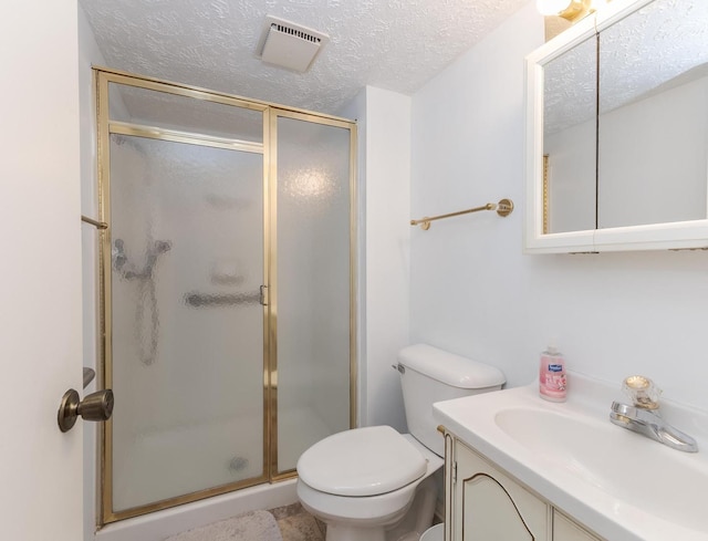 full bathroom featuring a shower stall, toilet, a textured ceiling, and visible vents