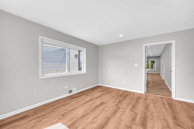 211 W 112th Pl, Chicago, IL 60628 - empty room with baseboards, visible vents, recessed lighting, and light wood-style floors