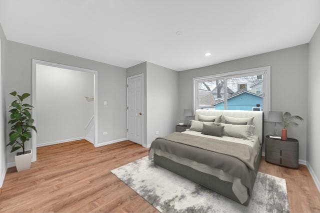 211 W 112th Pl, Chicago, IL 60628 - bedroom with baseboards and light wood-style flooring