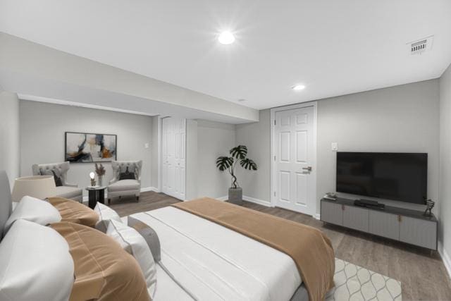 211 W 112th Pl, Chicago, IL 60628 - bedroom featuring recessed lighting, wood finished floors, visible vents, and baseboards
