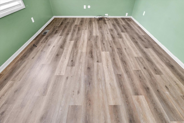 1045 Briarcliff Dr, Rantoul, IL 61866 - empty room featuring wood finished floors and baseboards