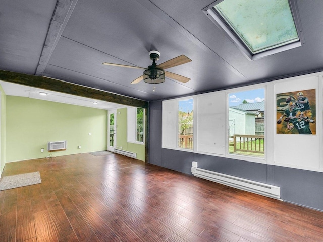 1045 Briarcliff Dr, Rantoul, IL 61866 - spare room featuring a baseboard radiator, a skylight, a wall mounted air conditioner, ceiling fan, and beamed ceiling