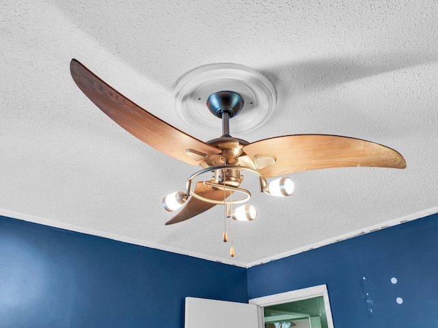 1045 Briarcliff Dr, Rantoul, IL 61866 - detailed view of a ceiling fan and a textured ceiling
